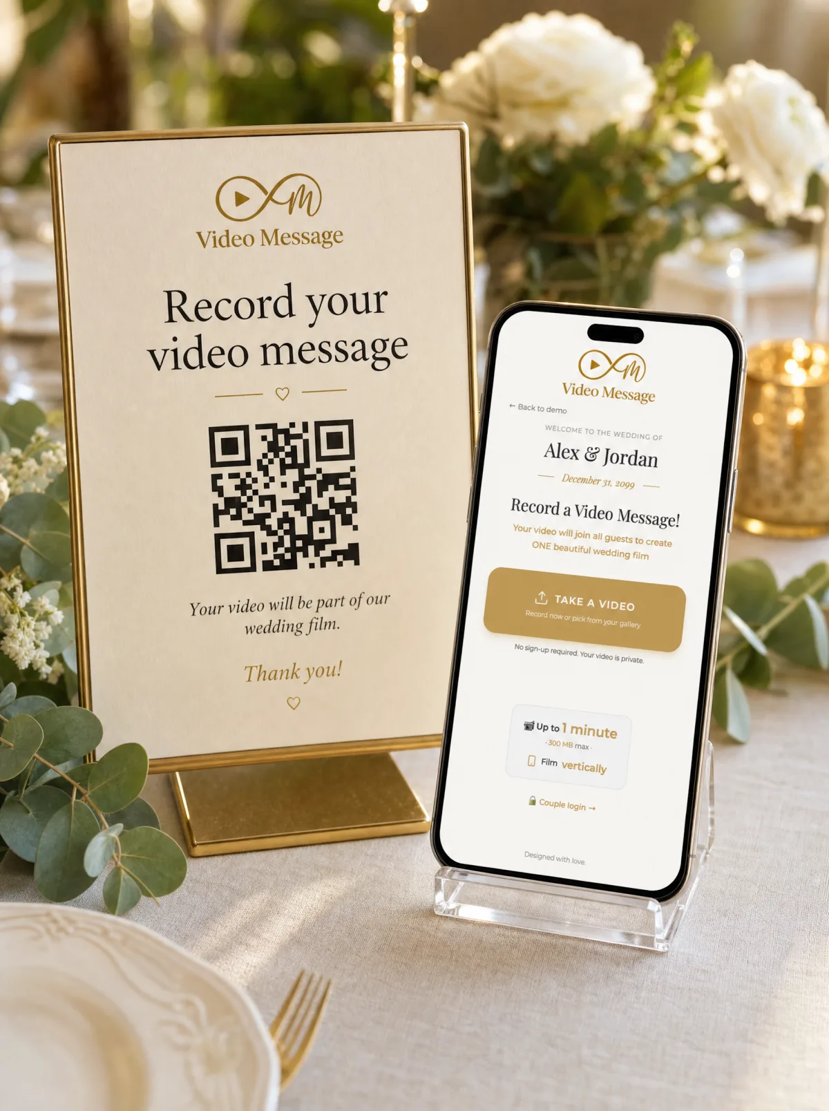 A printed QR code sign on an elegant wedding table next to a smartphone showing the video guest book recording page